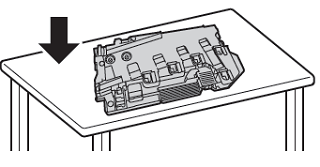 Place the waste cartridge on a flat surface