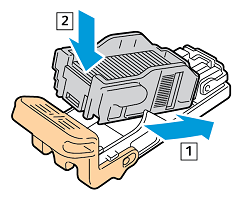 Insert new staple pack into staple cartridge, rear side into cartridge